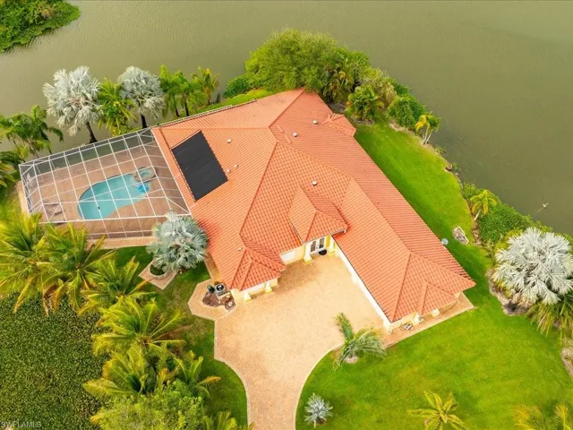 Aerial view of property and surrounding area with a pool area