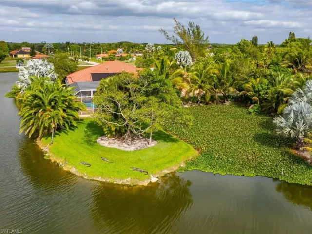 Drone / aerial view of a large body of water and a tree filled landscape