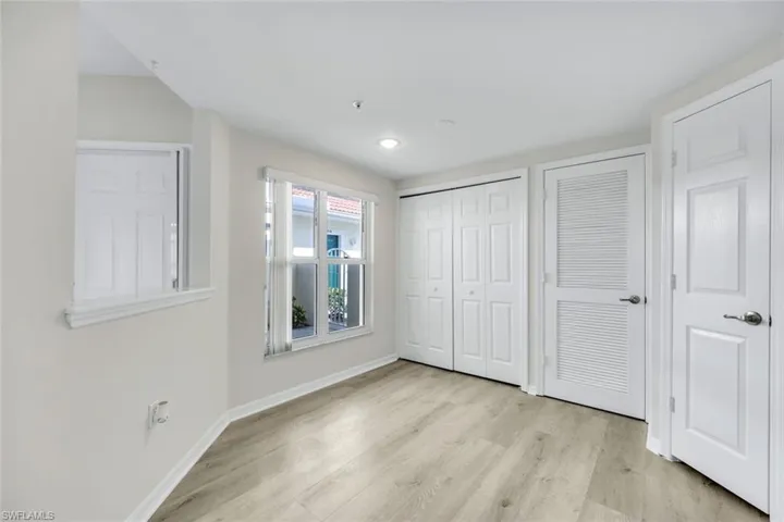 Unfurnished bedroom with light wood finished floors, a closet, and recessed lighting