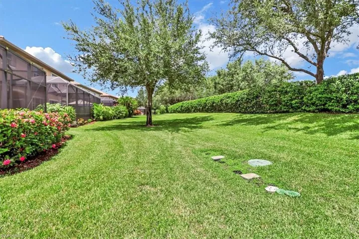 View of yard featuring a lanai
