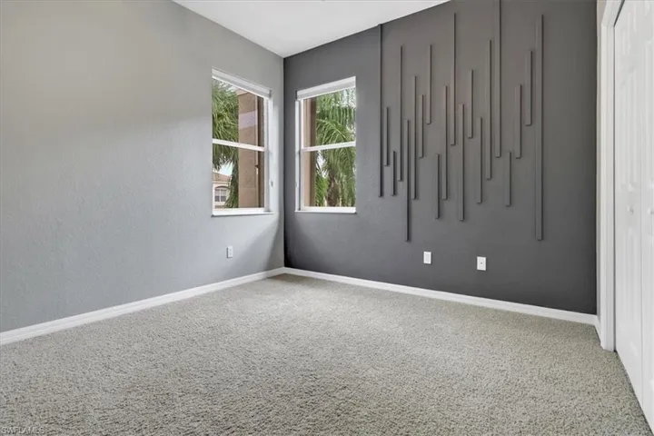 Unfurnished room with carpet flooring