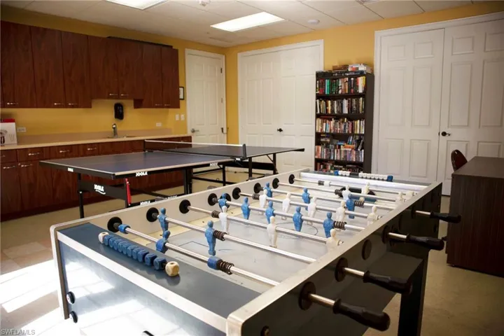 Game room with a paneled ceiling