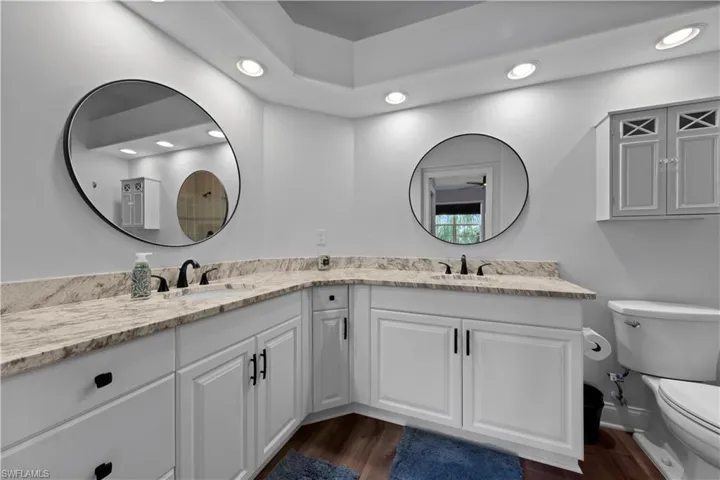 Beautifully updated primary bath with dual sinks and level 3 granite
