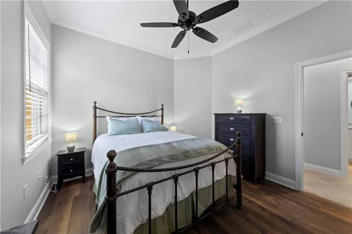 Bedroom featuring new wood-like viniyl flooring.