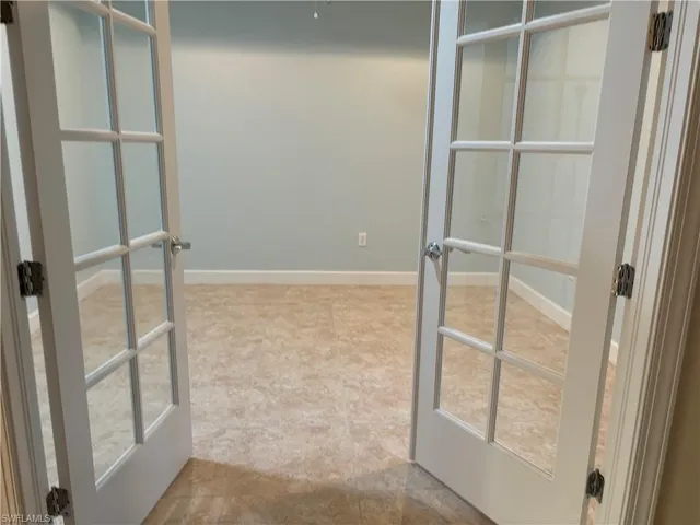 office /den featuring french doors and light tile patterned flooring
