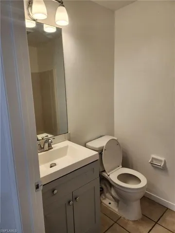 Bathroom with vanity and light tile patterned floors