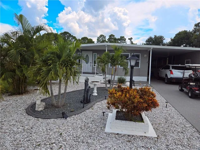 View of front of home featuring a carport