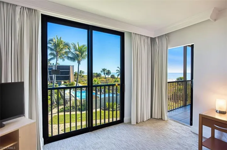 Primary Bedroom with pool view and slider that exits onto lanai