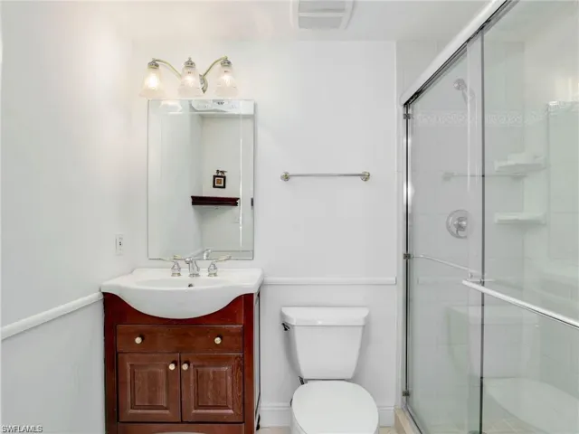 Bathroom with vanity and a shower stall