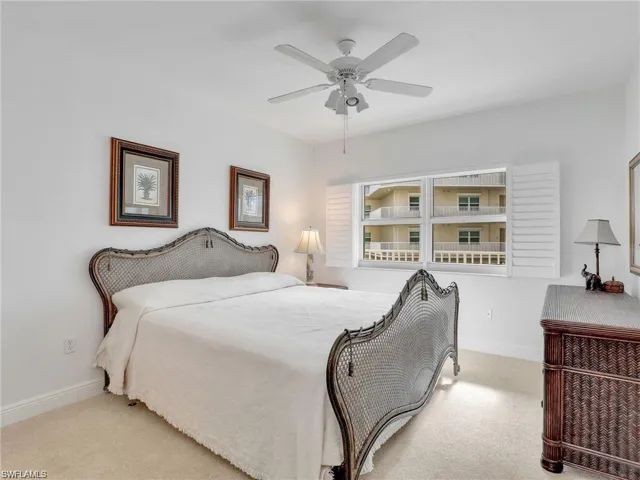 Bedroom with carpet flooring and a ceiling fan