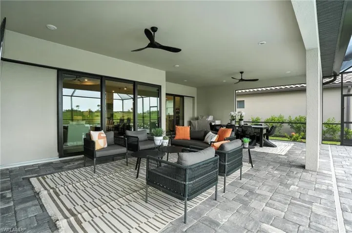 View of patio / terrace with a ceiling fan and an outdoor hangout area