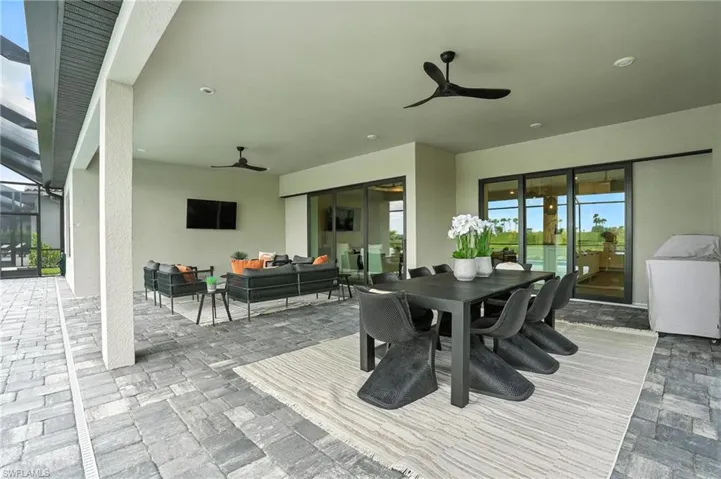 Dining room featuring ceiling fan and stone finish flooring