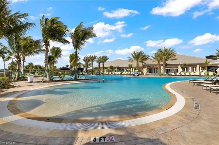 Community pool featuring a patio