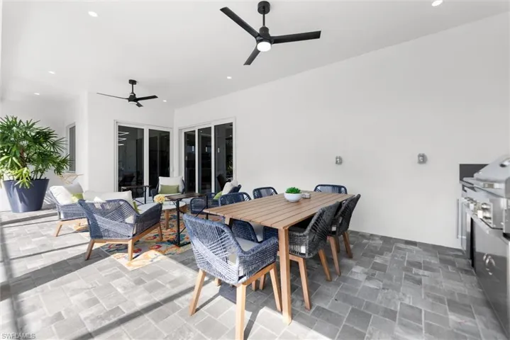 View of patio / terrace with ceiling fan, outdoor lounge area, and area for grilling