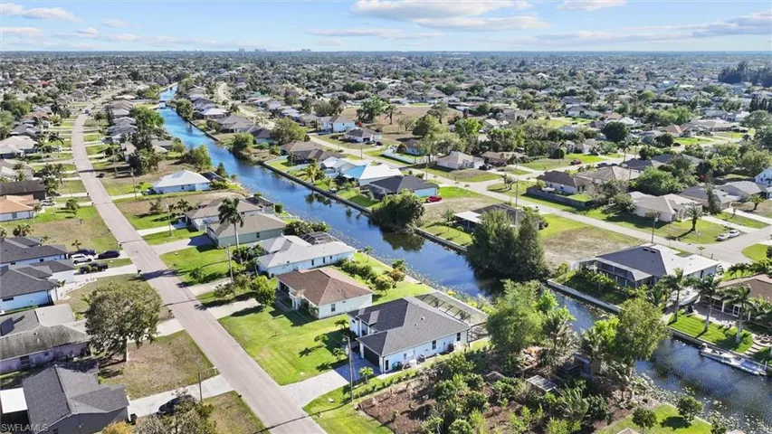 Aerial view of residential area with a large body of water