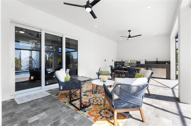 View of patio / terrace featuring ceiling fan, area for grilling, and outdoor lounge area
