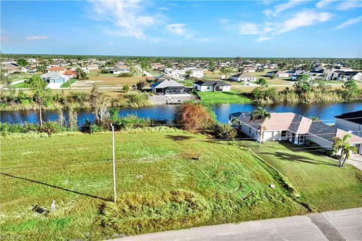 Aerial view of residential area with a large body of water