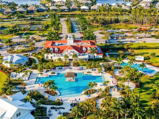 Aerial view of residential area featuring a pool area