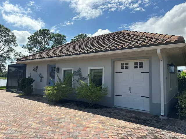 View of home's exterior with a garage