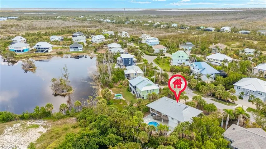 Aerial view of residential area with a large body of water