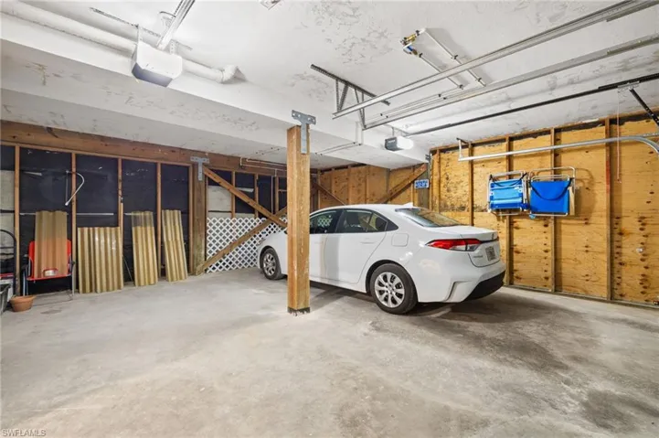 Garage featuring a garage door opener
