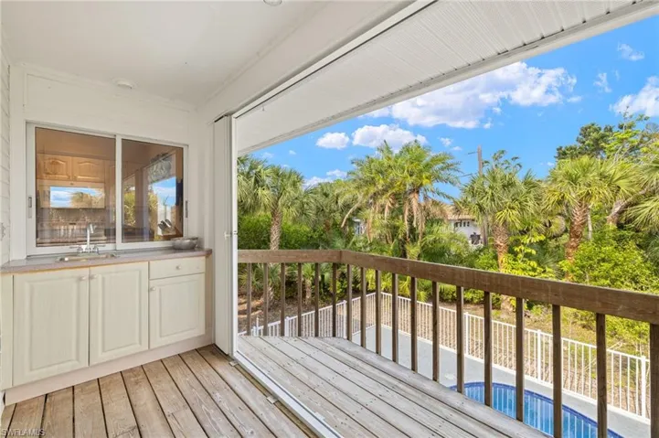 Wooden deck featuring a sink