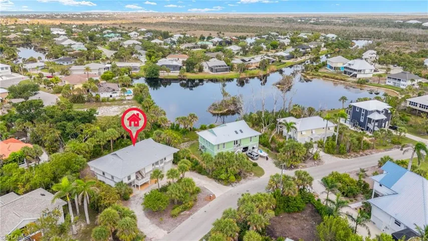 Aerial perspective of suburban area with a nearby body of water