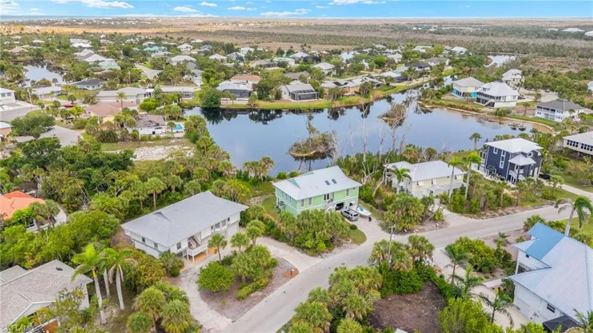 Aerial view of residential area with a large body of water