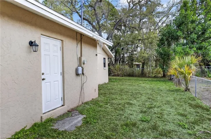 View of fenced backyard