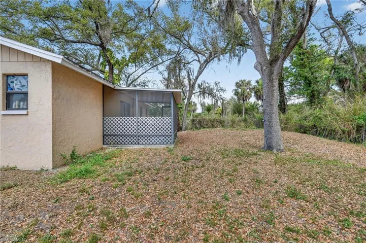 View of yard featuring a sunroom