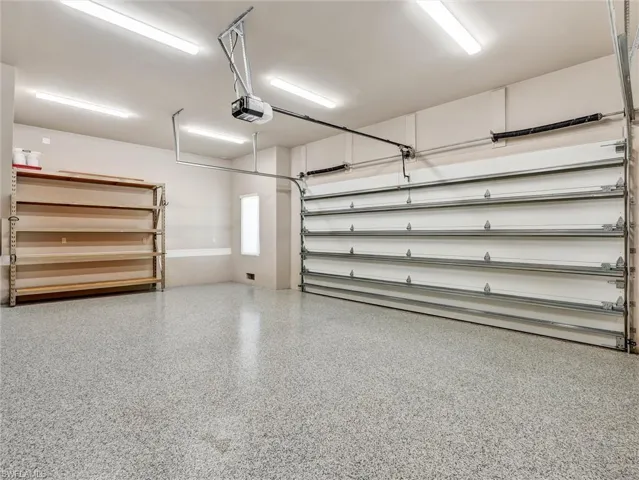 Wonderful, oversized garage with polyaspartic floor & A/C split unit for year round comfort