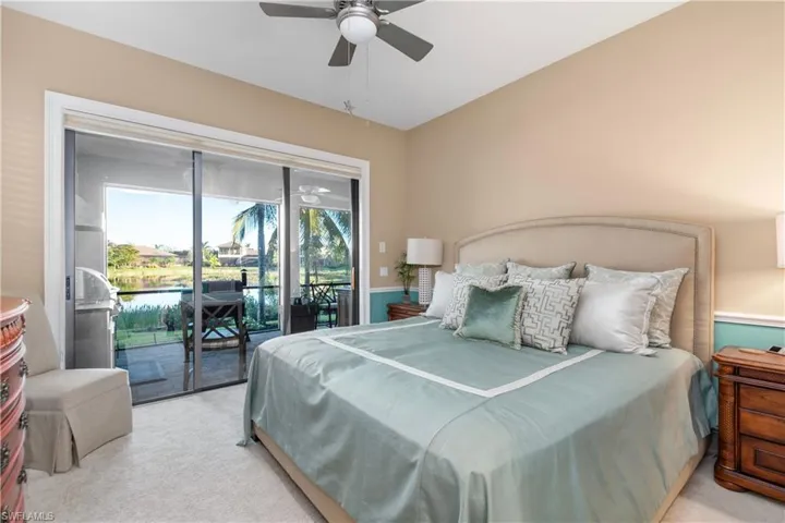 Carpeted bedroom featuring access to outside.