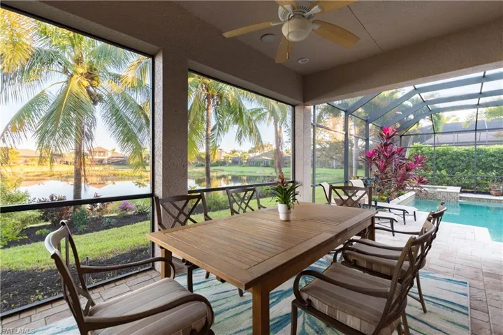 Lanai featuring a wealth of natural light, a water view, and ceiling fan