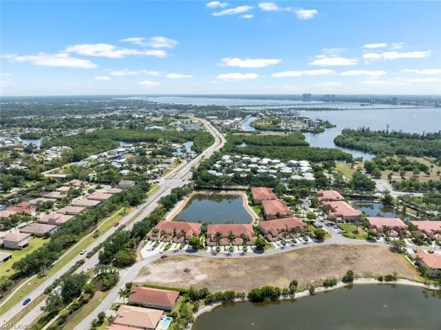 Birds eye view of property featuring a residential view and a water view