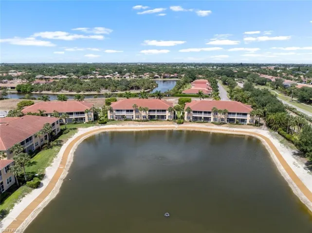 Drone / aerial view featuring a residential view and a water view