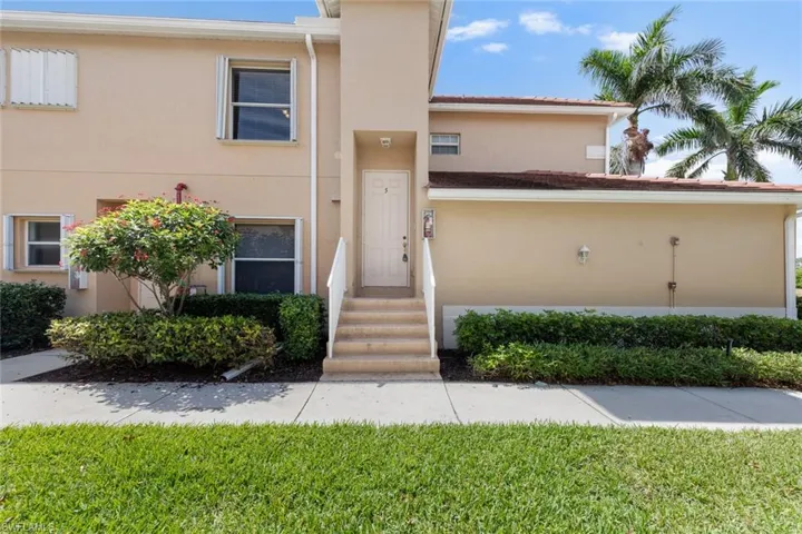 View of property with stucco siding