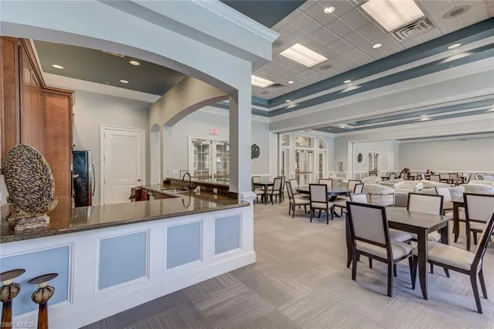 Welcome area with arched walkways, french doors, a sink, and visible vents