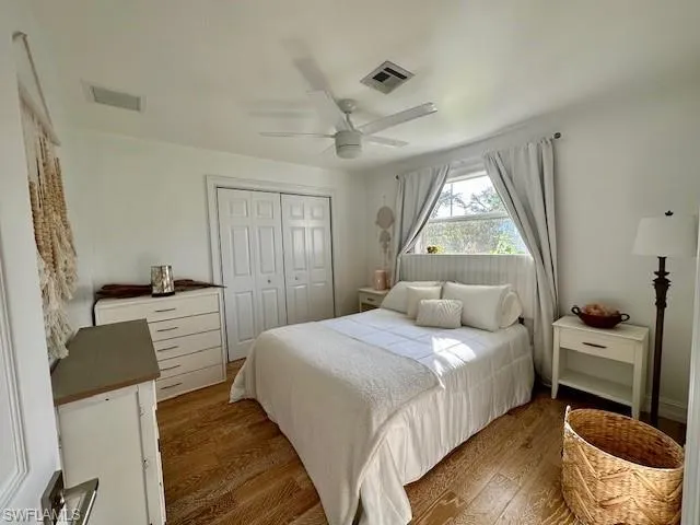 2nd Bedroom with wood finished floors, a closet, and a ceiling fan
