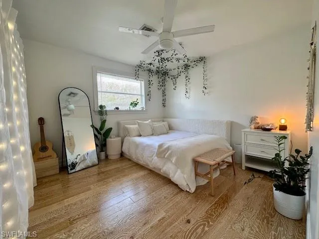 3rd Bedroom with light wood-style floors and ceiling fan