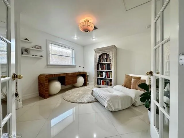 Den featuring small storage closet