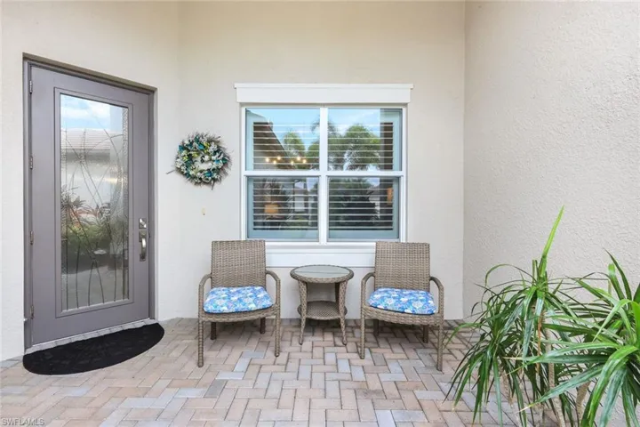 Doorway to property with a patio area