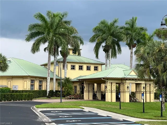 View of property with uncovered parking