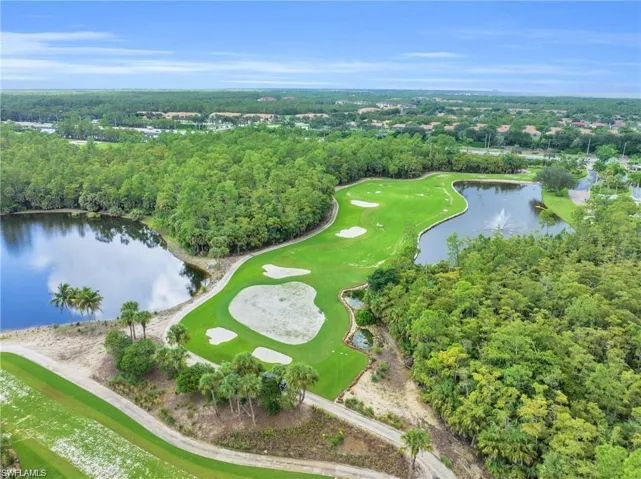 Aerial view of a nearby body of water and a golf club