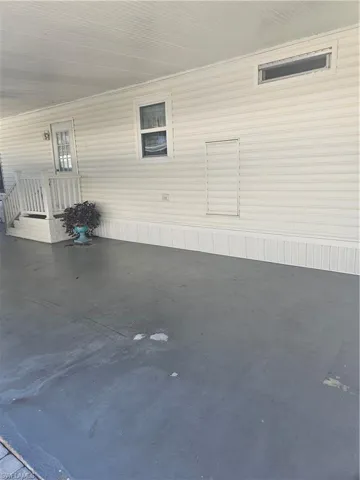 View of patio / terrace featuring a carport