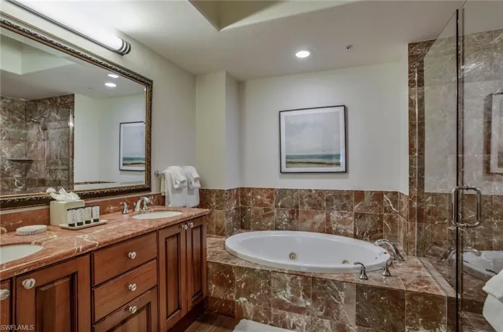Primary bathroom with full tub and walk-in shower