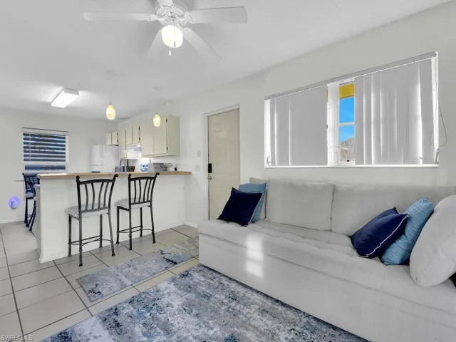 21602 Tiled living room with a textured ceiling and ceiling fan