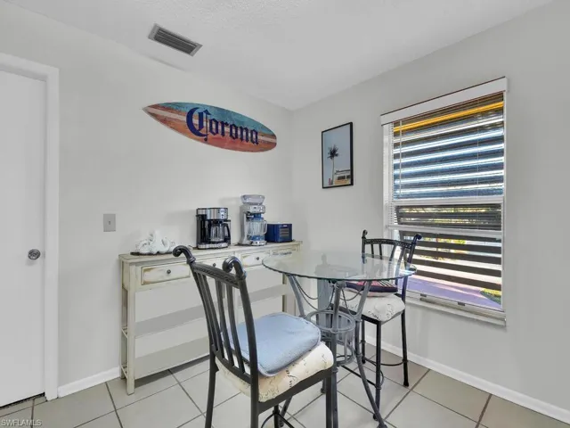 21602 Dining area with light tile patterned floors and a textured ceiling