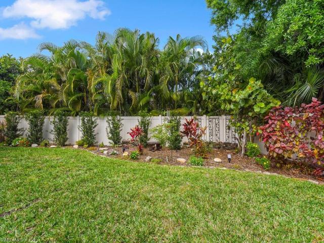 Fenced In Back Yard with Recently Planted Hedges