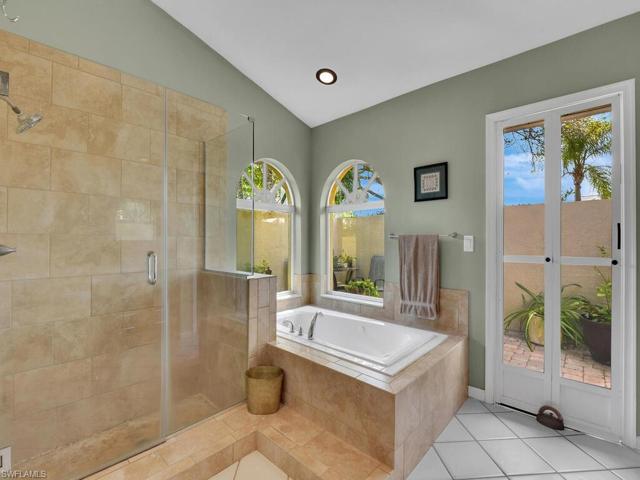 Large Primary Bath with Soaking Tub and Walk-in Shower. Entrance to Private Courtyard