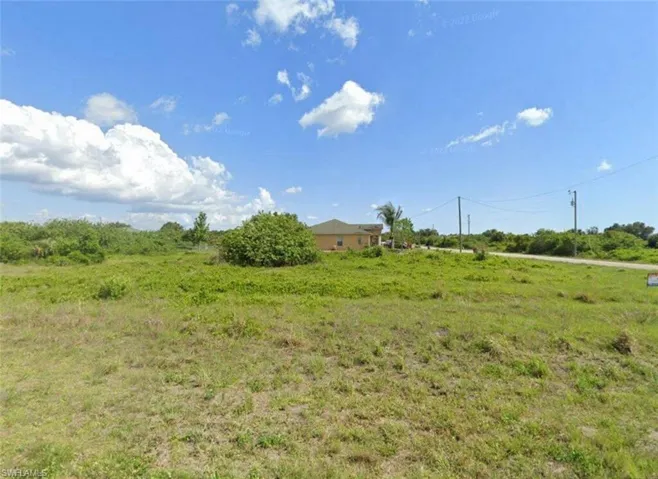 View of yard with a view of countryside